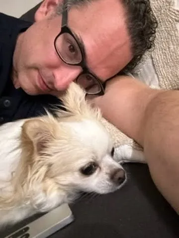 Carmelo, Director of Resting Rainbow of the Treasure Coast, with his dogs